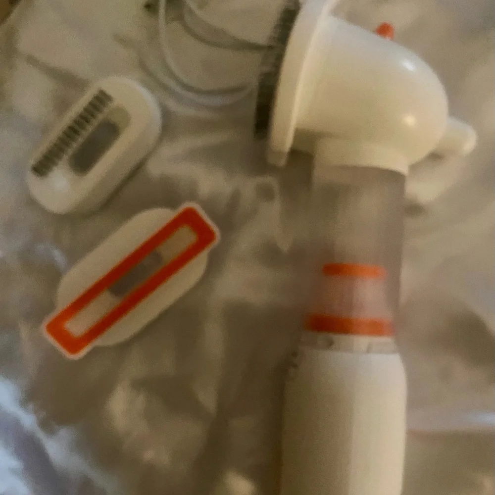 NEW, in box, (never used) a pet (dog or cat) vacuum. Get rid of that pesky hair!